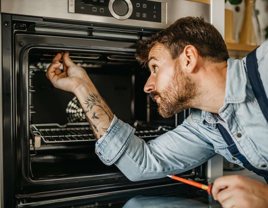 A Landers tech is conducting wall oven repair in Baltimore, MD